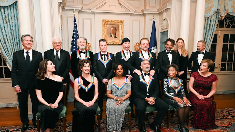 2022 Kennedy Center Honoree George Clooney, bottom third from right, reacts as he is given a...