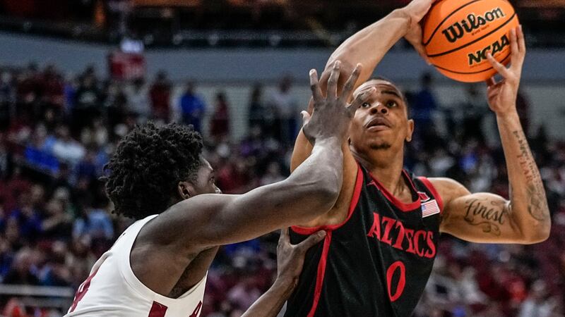 San Diego State forward Keshad Johnson (0) shoots against Alabama center Charles Bediako (14)...