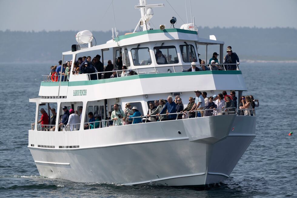 A puffin watch tour boat is positioned off Eastern Egg Rock, Maine, Sunday, Aug. 5, 2023....