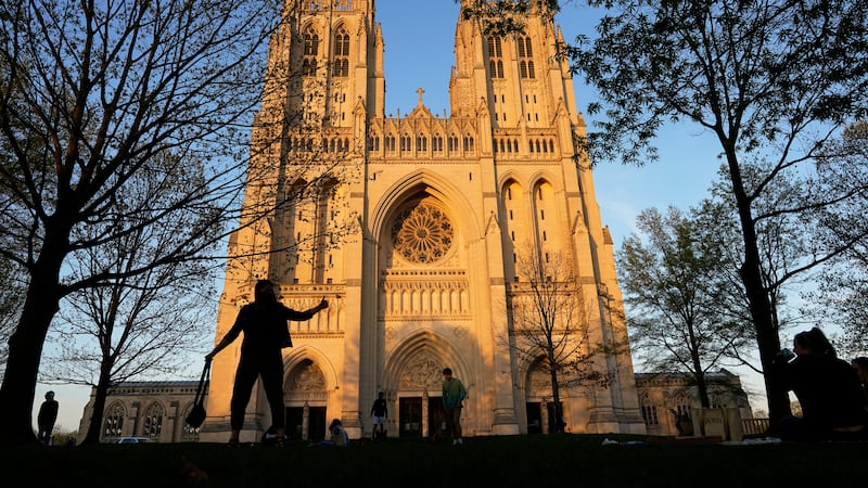 FILE - The Washington National Cathedral is seen at sunset, April 13, 2021, in Washington. The...