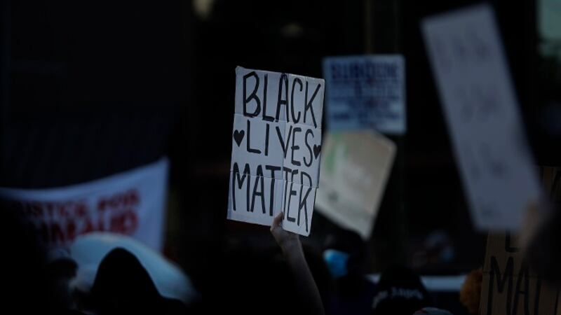 A "Black Lives Matter" sign is seen during protests on Saturday, June 13,...