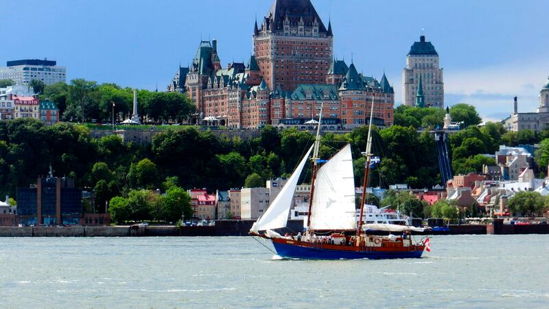 Quebec City's iconic Fairmont Le Chateau Frontenac dominates the city skyline from the ferry...